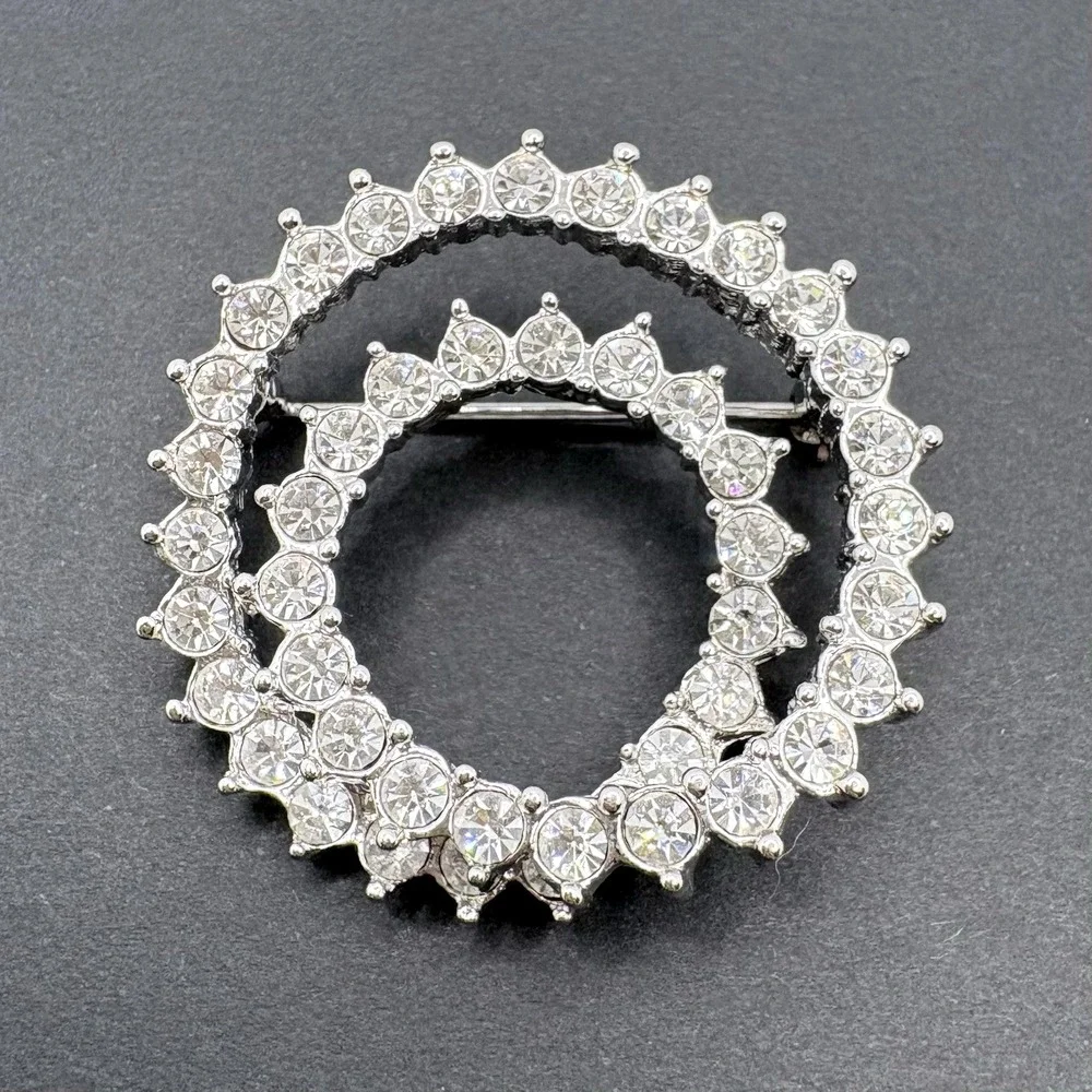 Vintage Nolan Miller Swirl Circle Brooch Silver Tone Crystal Glamour Collection